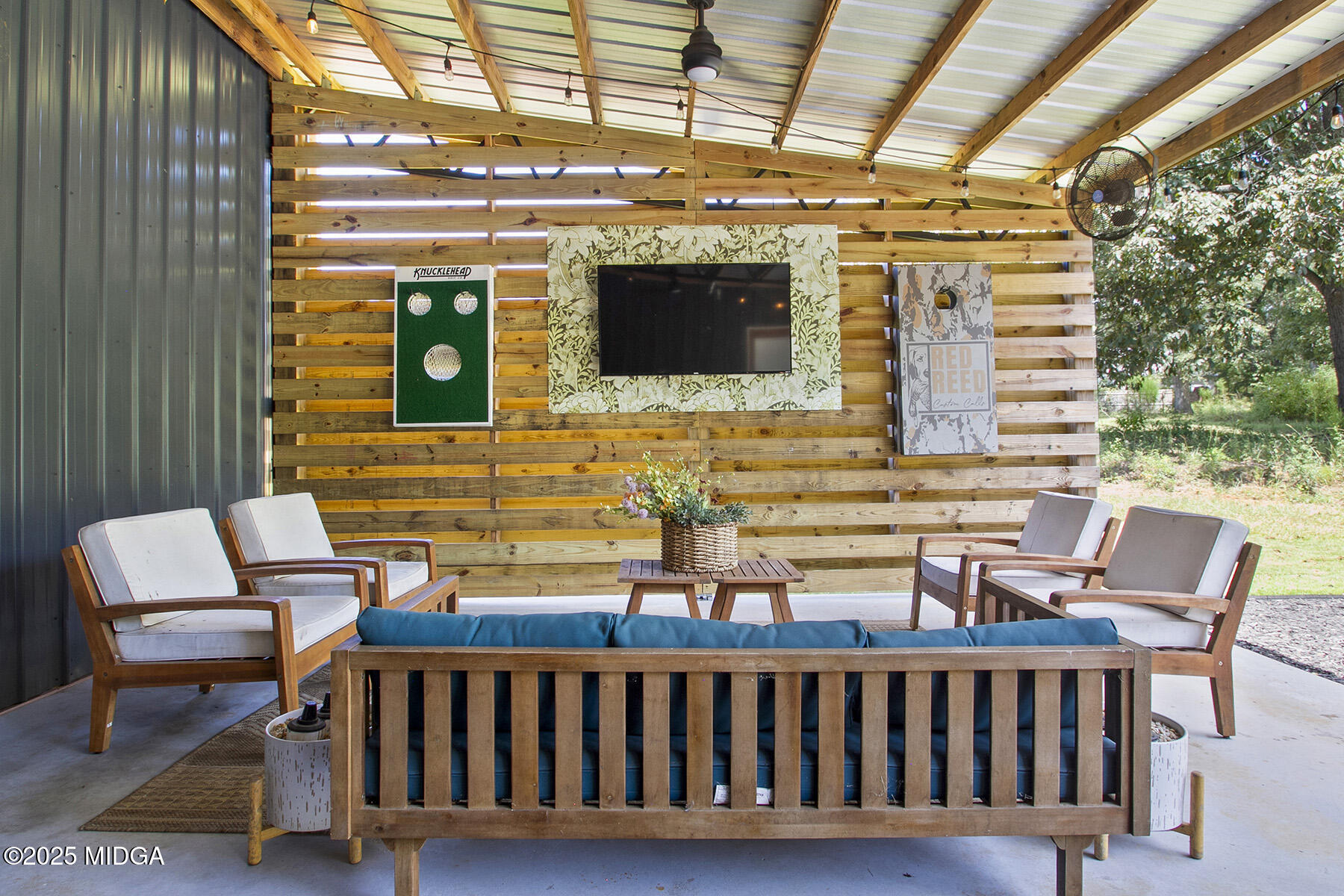 355 Dumas Road Forsyth, GA 31029 - Photo 30 of 53 a view of a chair and table in the balcony