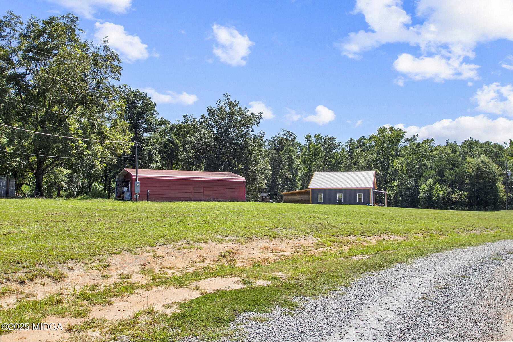 355 Dumas Road Forsyth, GA 31029 - Photo 34 of 53 a front view of a house with a garden and yard