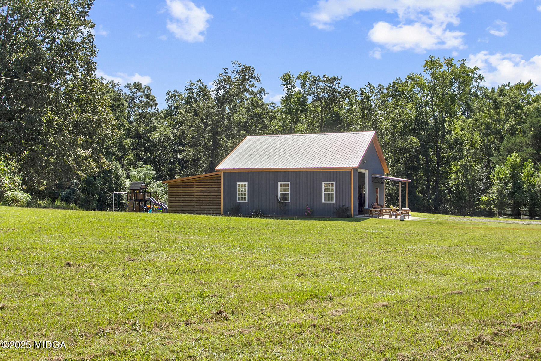 355 Dumas Road Forsyth, GA 31029 - Photo 35 of 53 a front view of a house with a yard