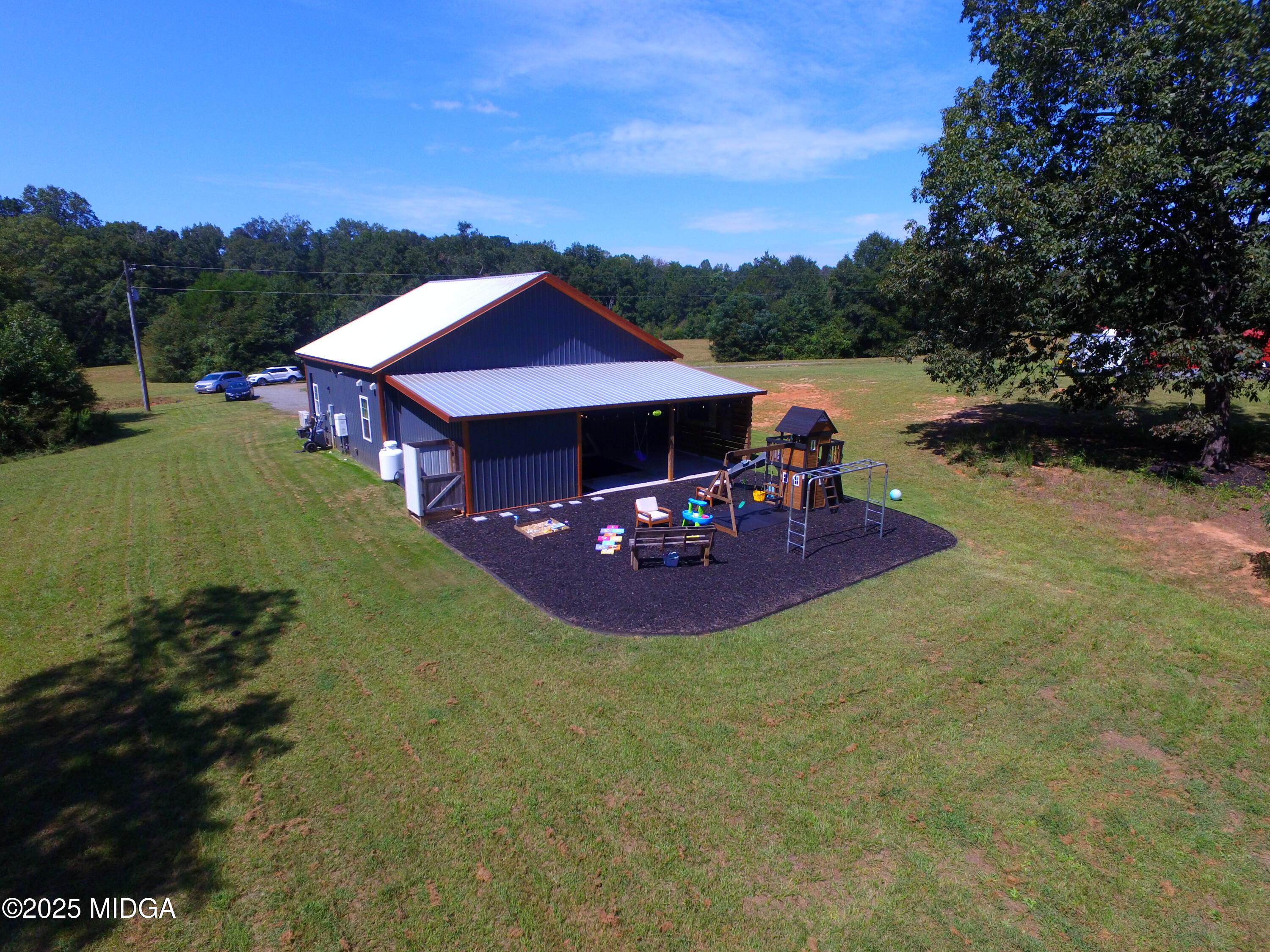 355 Dumas Road Forsyth, GA 31029 - Photo 40 of 53 a view of a house with pool and sitting area