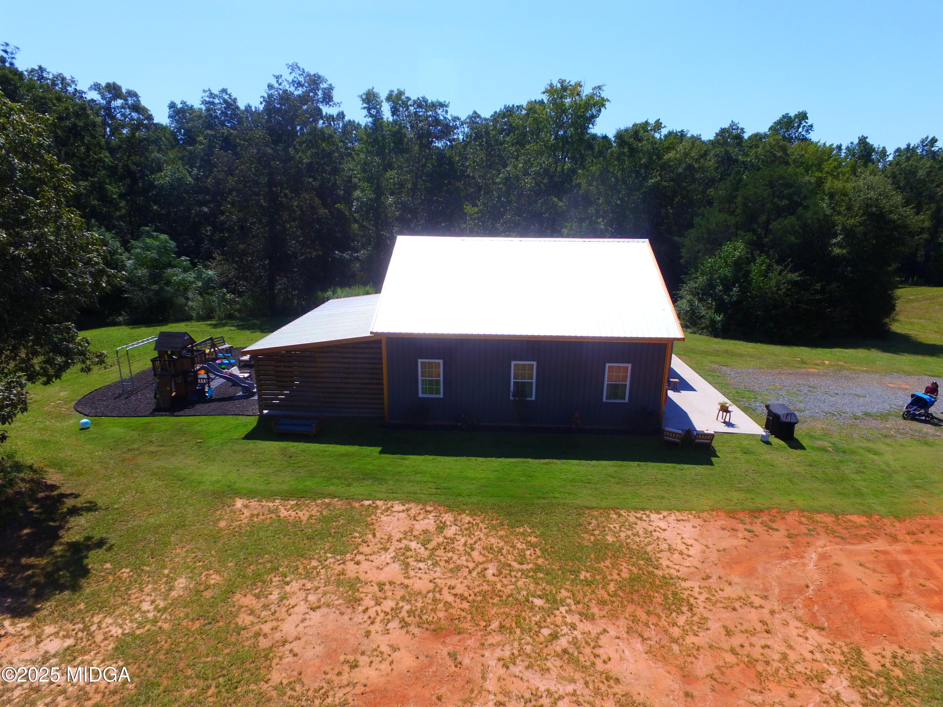 355 Dumas Road Forsyth, GA 31029 - Photo 42 of 53 a view of a house with a yard