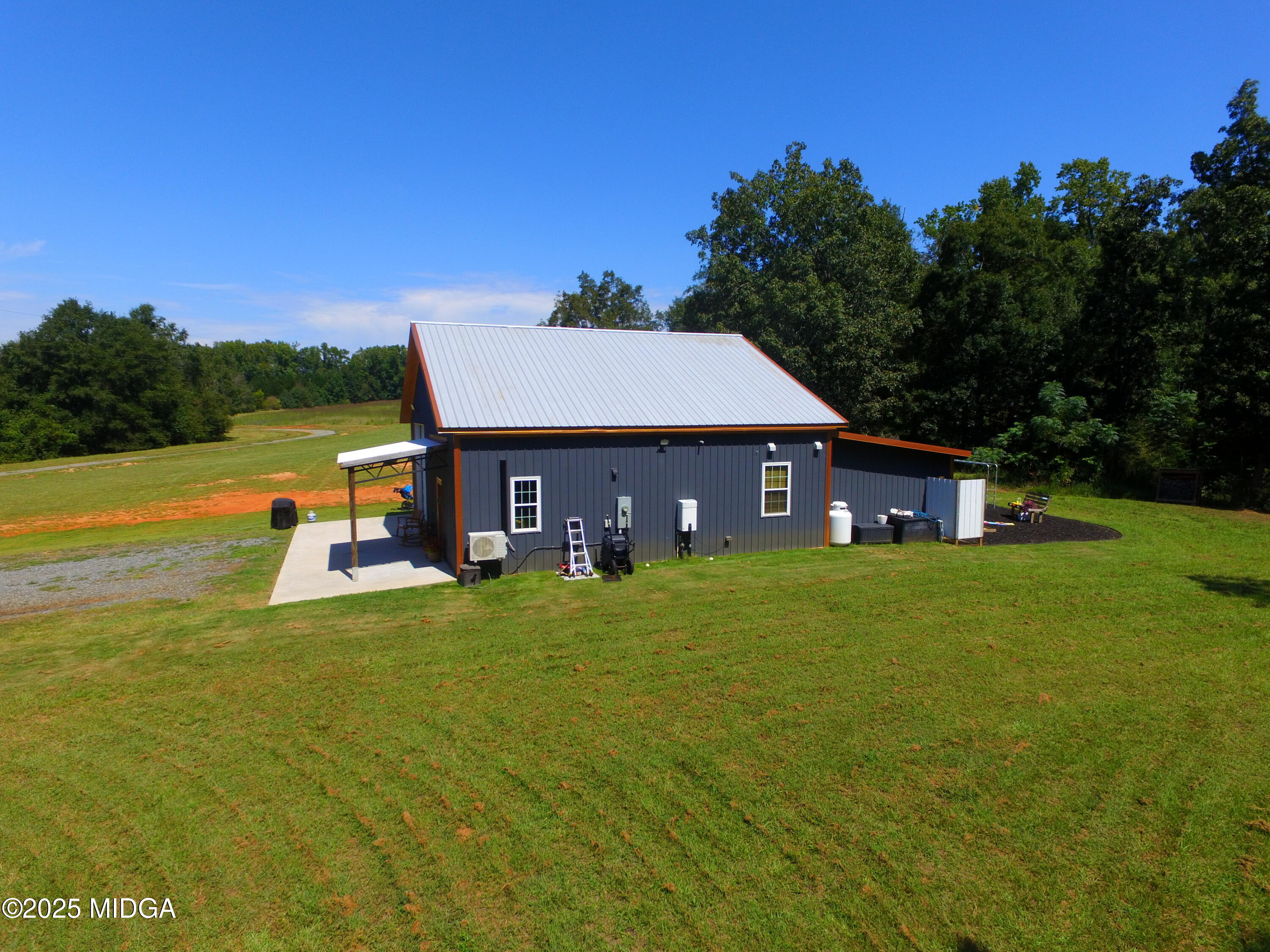 355 Dumas Road Forsyth, GA 31029 - Photo 43 of 53 a view of a house with a yard