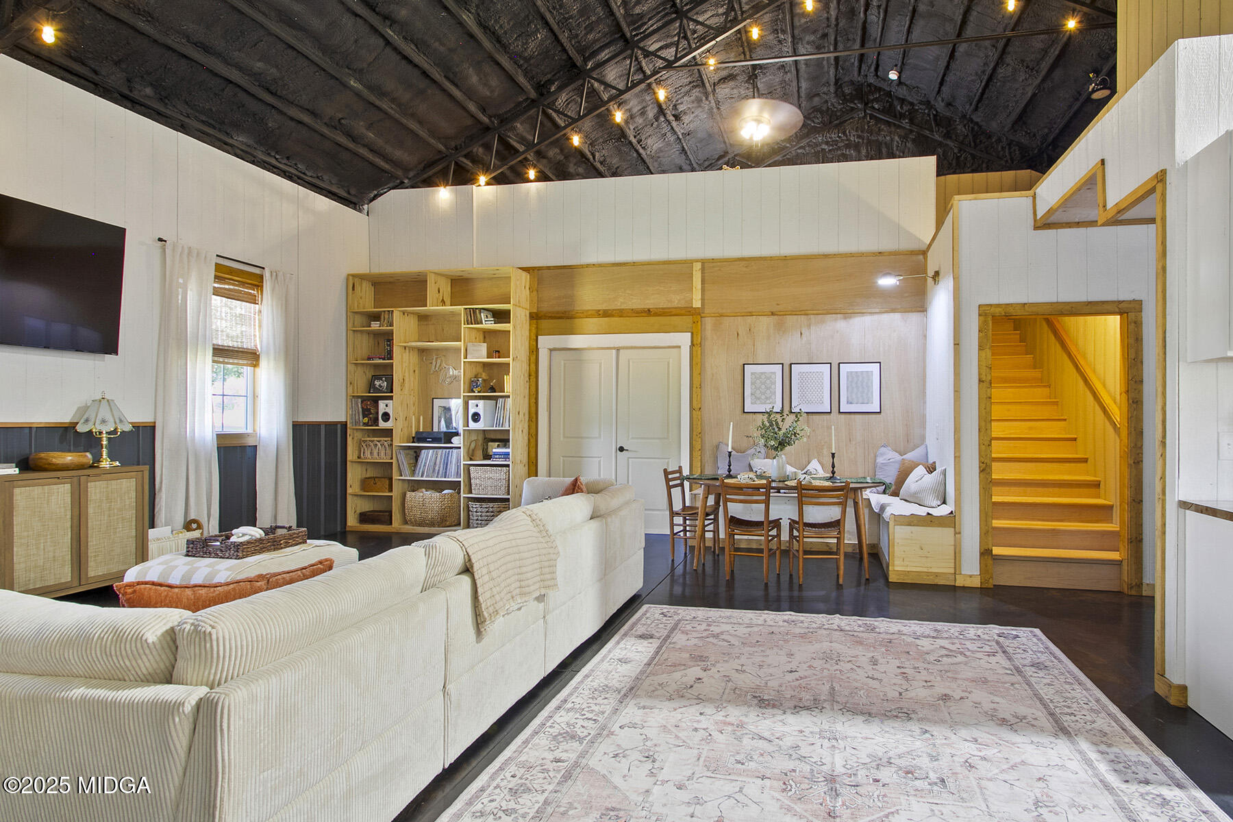 355 Dumas Road Forsyth, GA 31029 - Photo 6 of 53 a living room with furniture a flat screen tv and a table