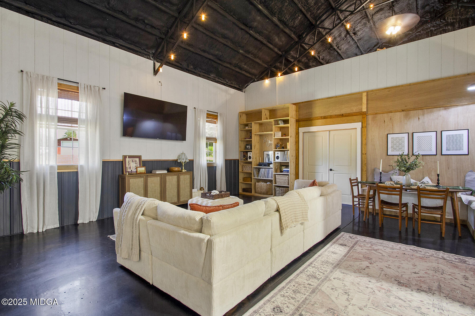 355 Dumas Road Forsyth, GA 31029 - Photo 7 of 53 a living room with furniture and a flat screen tv