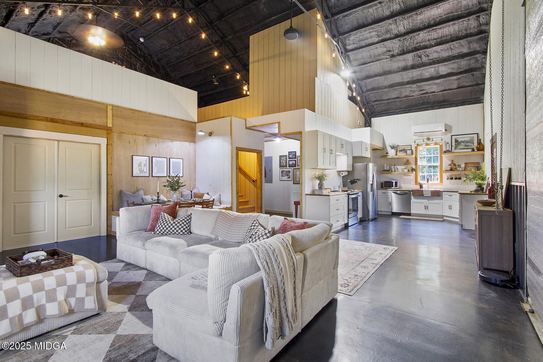 355 Dumas Road Forsyth, GA 31029 - Photo 9 of 53 a living room with furniture and a chandelier