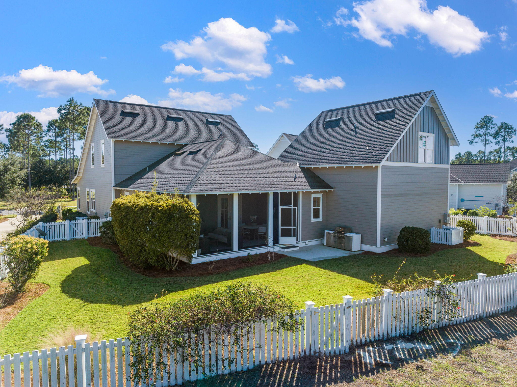 Undisclosed Address Watersound, FL 32461 - Photo 72 of 94 a view of a house with backyard and sitting area