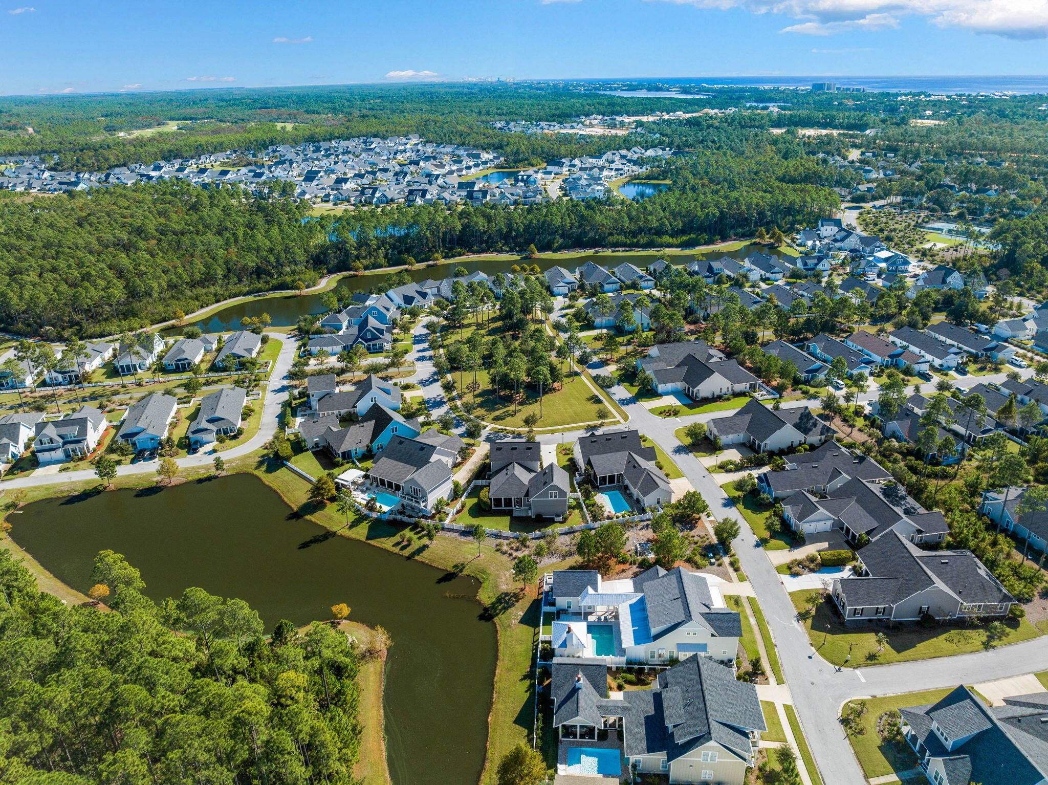 Undisclosed Address Watersound, FL 32461 - Photo 85 of 94 an aerial view of a city with lots of residential buildings ocean and mountain view in back
