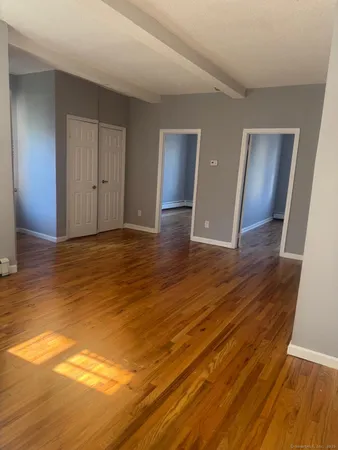 a view of a livingroom with wooden floor