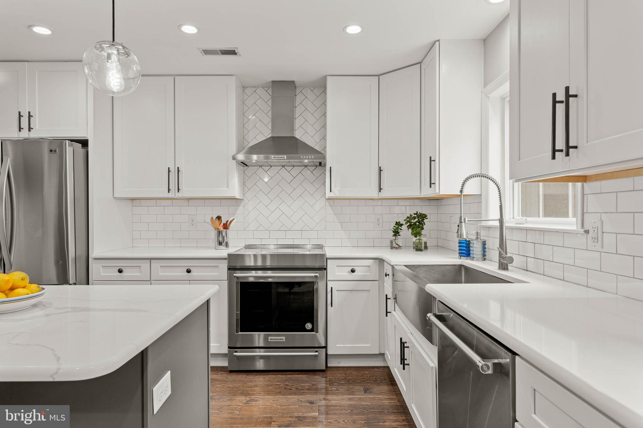 2330 Fairmount Avenue, Unit A Philadelphia, PA 19130 - Photo 11 of 34 a kitchen with stainless steel appliances granite countertop a sink stove and refrigerator
