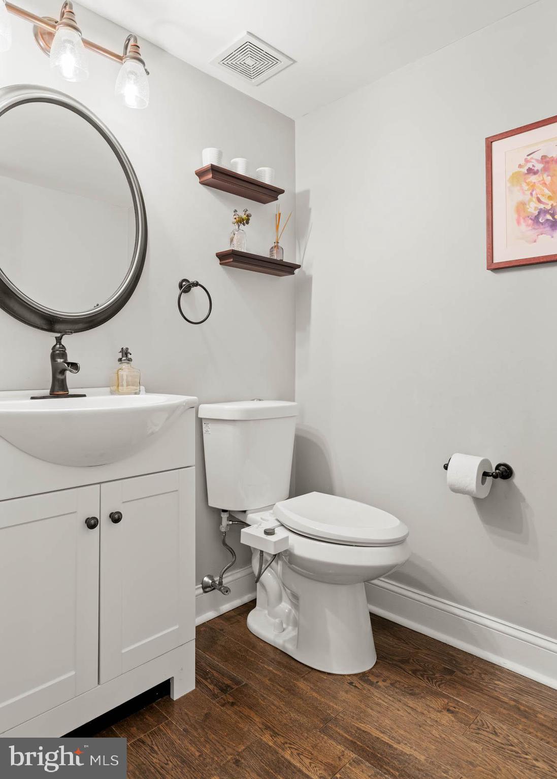 2330 Fairmount Avenue, Unit A Philadelphia, PA 19130 - Photo 13 of 34 a bathroom with a toilet sink and mirror