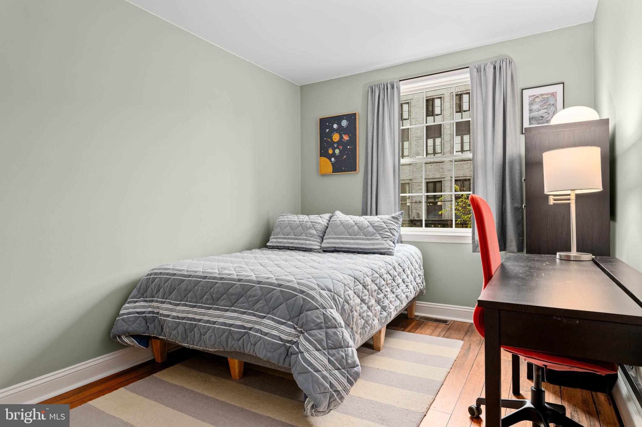 2330 Fairmount Avenue, Unit A Philadelphia, PA 19130 - Photo 15 of 34 a bedroom with a bed and a table in it