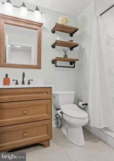 a bedroom with furniture and wooden floor