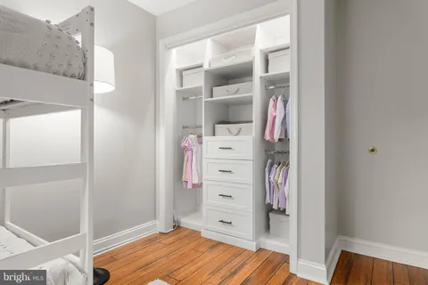 a bedroom with a bed and a cabinets