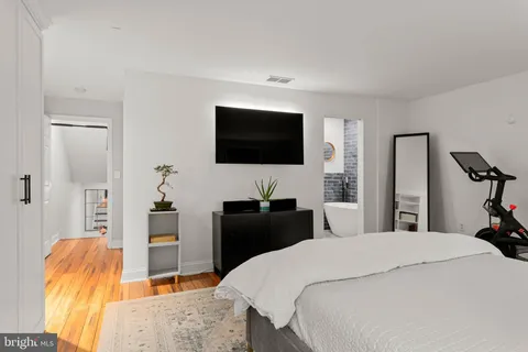 a bathroom with a sink a mirror and a shower