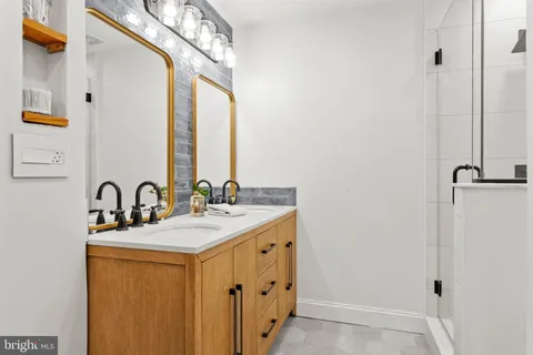 a bathroom with a shower a toilet and a shower