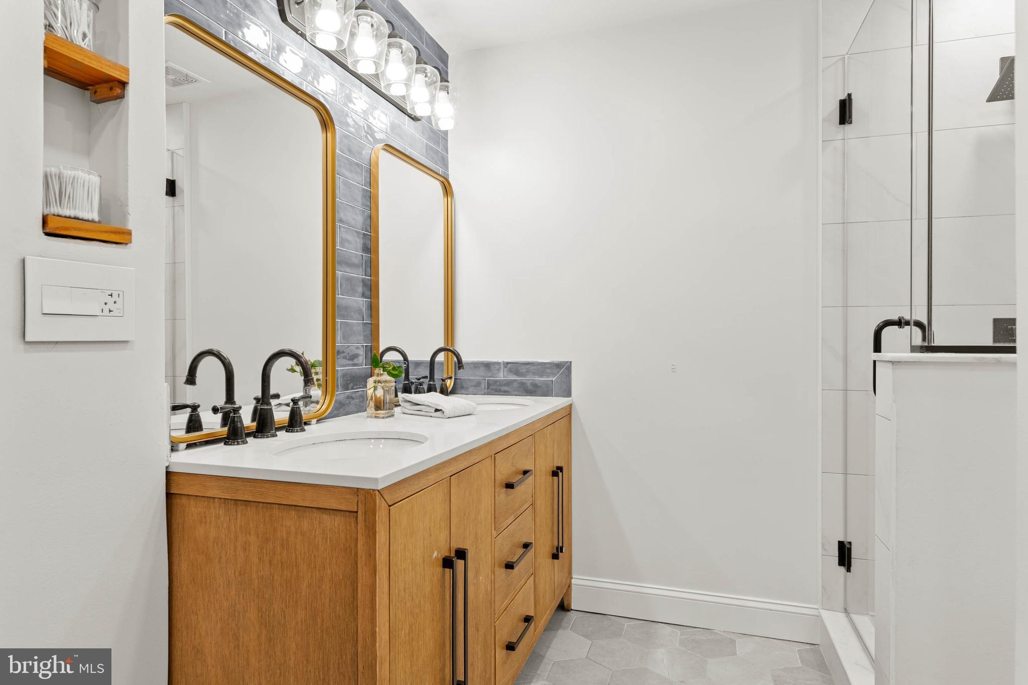2330 Fairmount Avenue, Unit A Philadelphia, PA 19130 - Photo 25 of 34 a bathroom with a sink a mirror and a shower