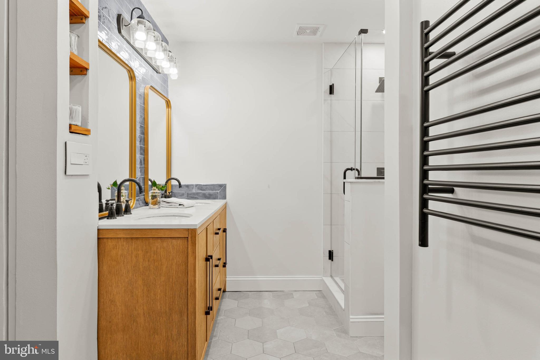 2330 Fairmount Avenue, Unit A Philadelphia, PA 19130 - Photo 26 of 34 a bathroom with a sink a mirror and a shower