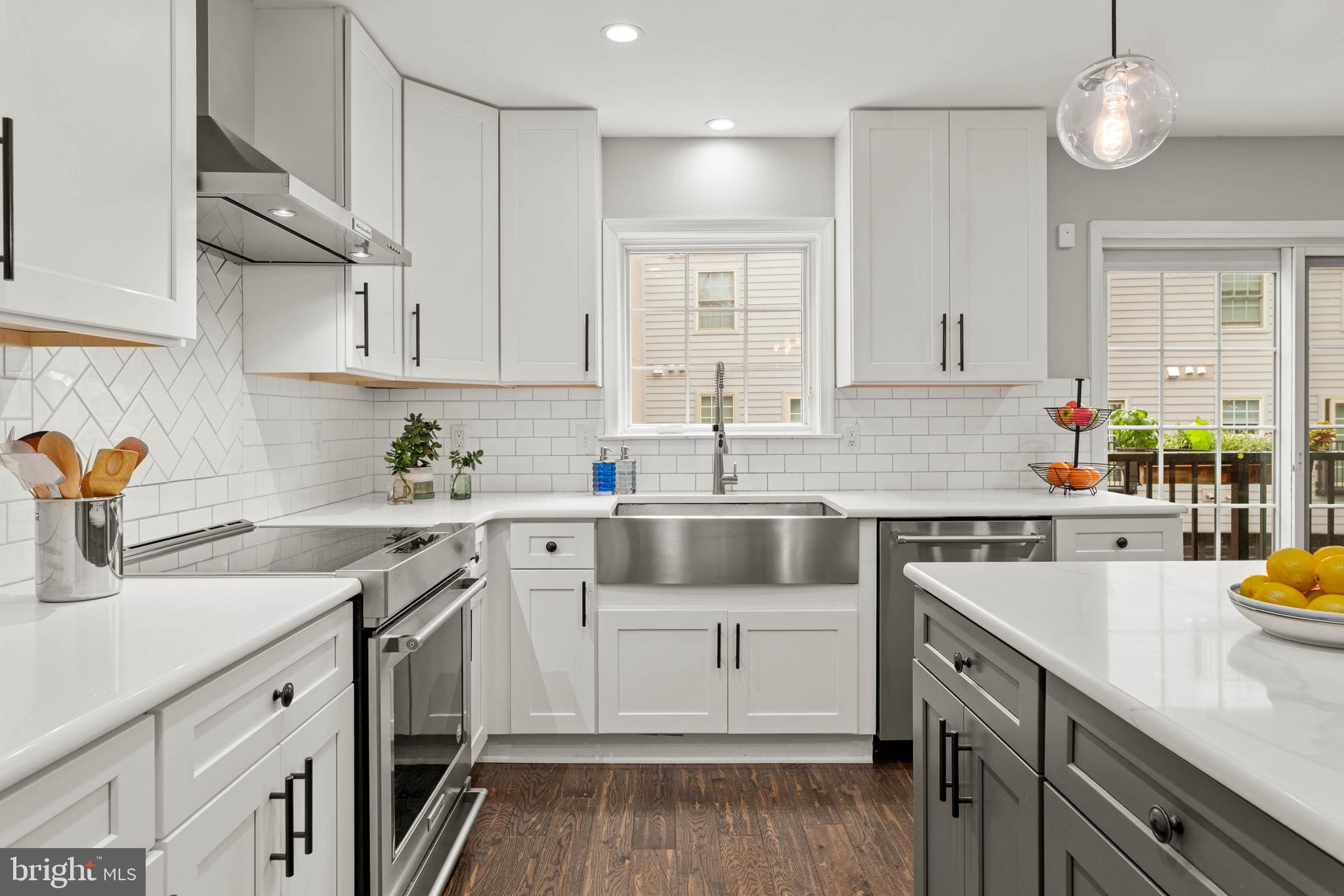 2330 Fairmount Avenue, Unit A Philadelphia, PA 19130 - Photo 10 of 34 a kitchen with a sink white cabinets and white appliances