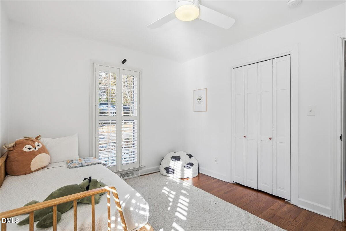 5904 Volant Drive Raleigh, NC 27609 - Photo 29 of 42 a bedroom with a bed and a window
