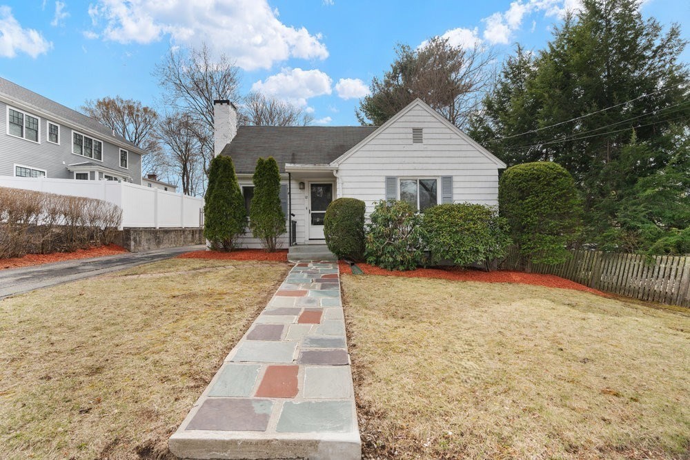 12 Pershing Road Newton, MA 02465 - Photo 1 of 29 a front view of a house with a yard