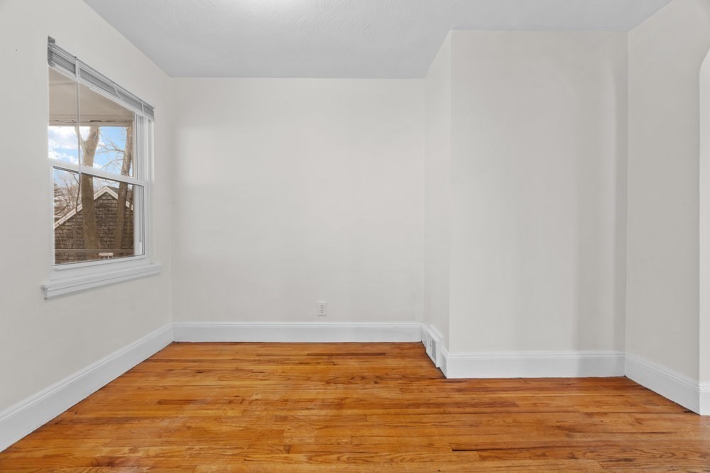 12 Pershing Road Newton, MA 02465 - Photo 12 of 29 a view of empty room with wooden floor and fan