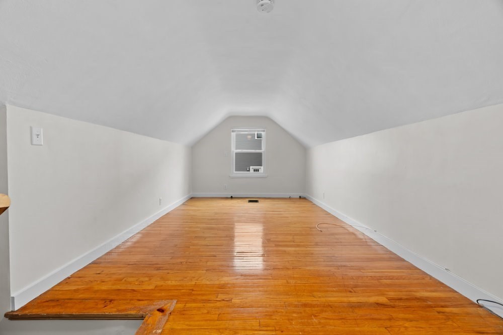 12 Pershing Road Newton, MA 02465 - Photo 18 of 29 a view of empty room with wooden floor