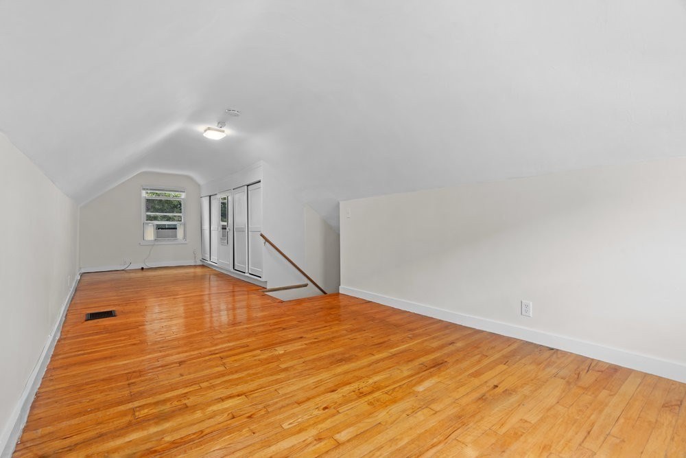 12 Pershing Road Newton, MA 02465 - Photo 20 of 29 a view of empty room with wooden floor