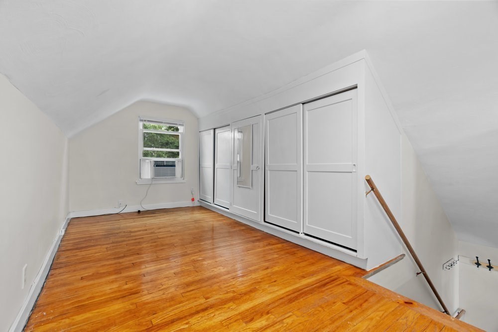 12 Pershing Road Newton, MA 02465 - Photo 21 of 29 a view of an empty room with a window