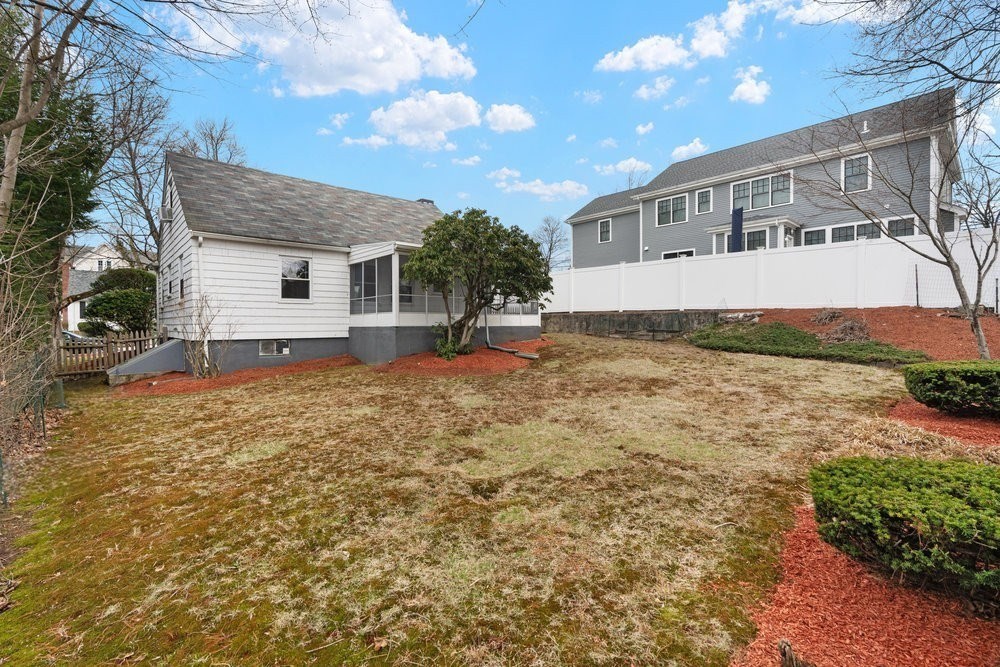 12 Pershing Road Newton, MA 02465 - Photo 24 of 29 a view of a house with a yard