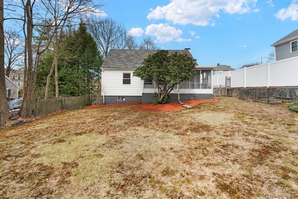 12 Pershing Road Newton, MA 02465 - Photo 25 of 29 a view of a house with a yard and garage