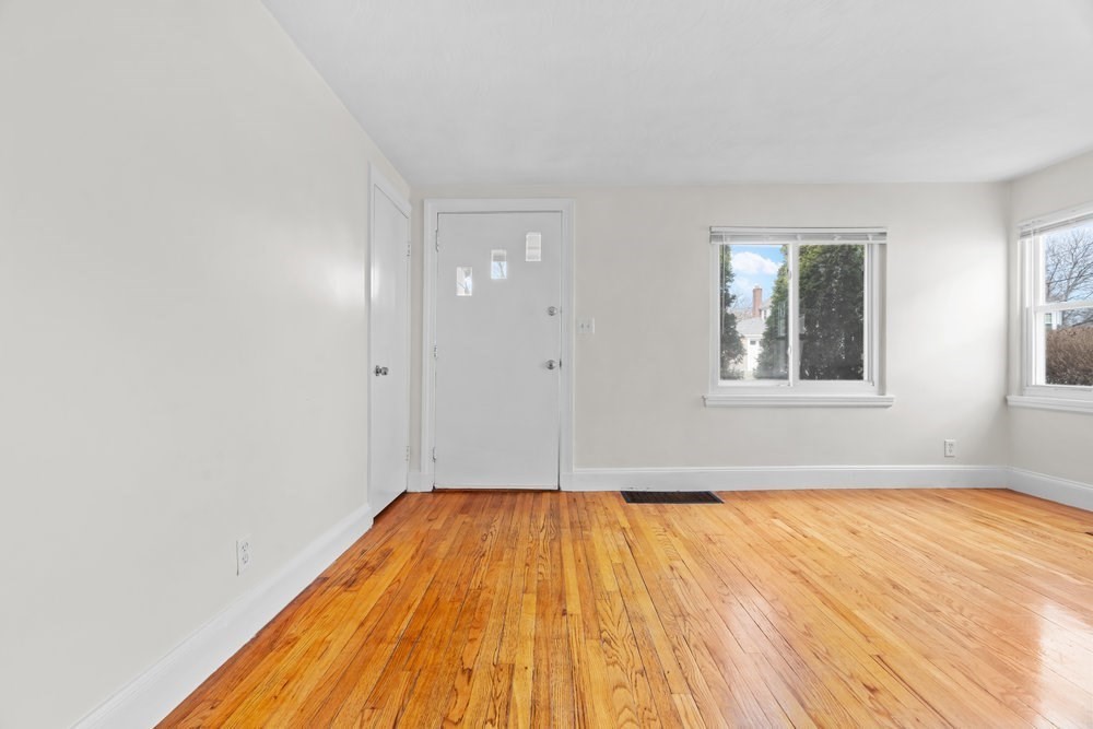 12 Pershing Road Newton, MA 02465 - Photo 5 of 29 a view of a room with wooden floor and window