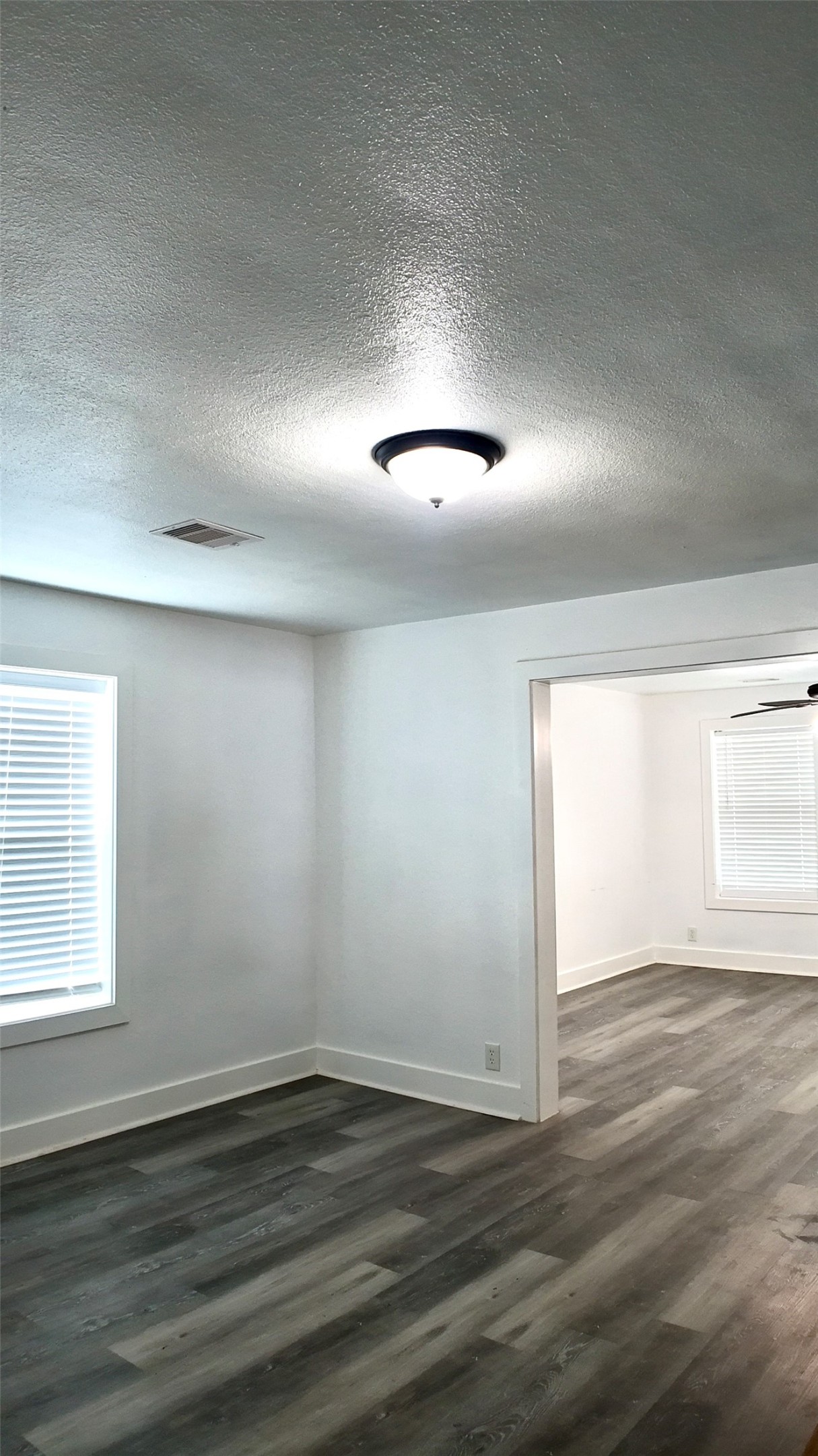 3618 Mainer Street Houston, TX 77021 - Photo 14 of 17 an empty room with wooden floor and windows