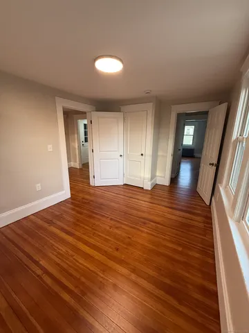 a view of a livingroom with wooden floor