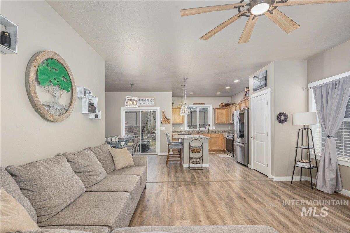 5668 West Old Ranch Street Boise, ID 83714 - Photo 11 of 44 Living room with a ceiling fan, light wood-style floors, and recessed lighting