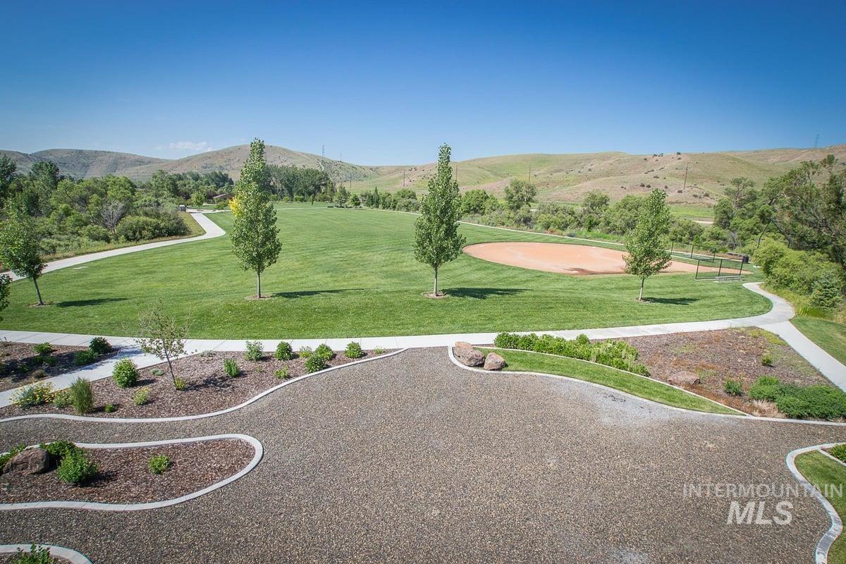 5668 West Old Ranch Street Boise, ID 83714 - Photo 42 of 44 View of home's community with a mountain view and a yard