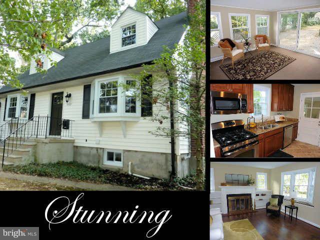 6521 Banbury Road Baltimore, MD 21239 - Photo 1 of 29 a front view of a house with a garden and patio