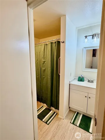 a room with a mirror and a sink