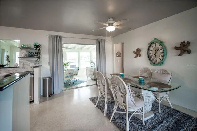 a dining room with furniture and window