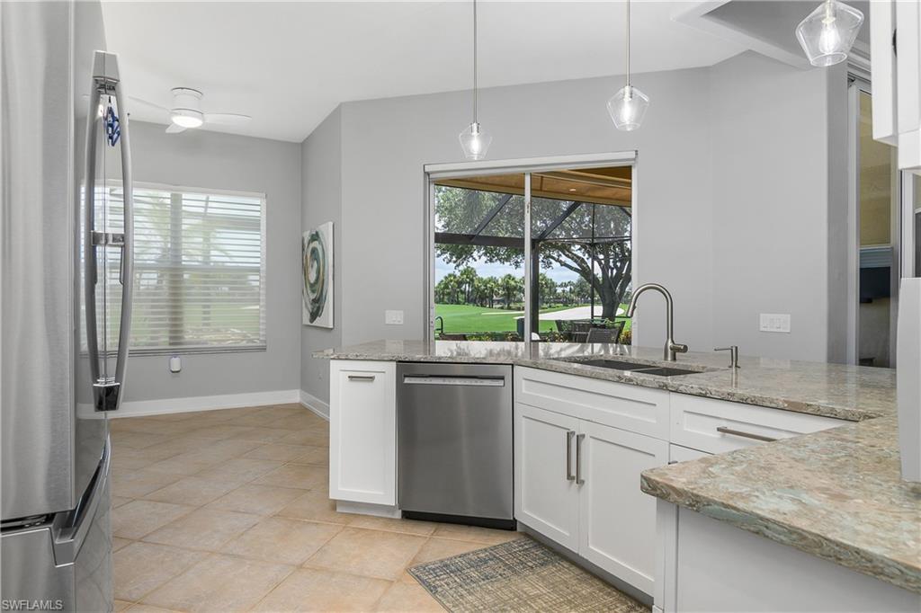 24361 Copperleaf Boulevard Estero, FL 34135 - Photo 13 of 49 a kitchen with stainless steel appliances granite countertop a stove and a sink