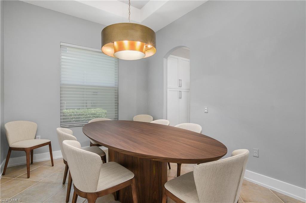 24361 Copperleaf Boulevard Estero, FL 34135 - Photo 14 of 49 a view of a dining room with furniture and wooden floor