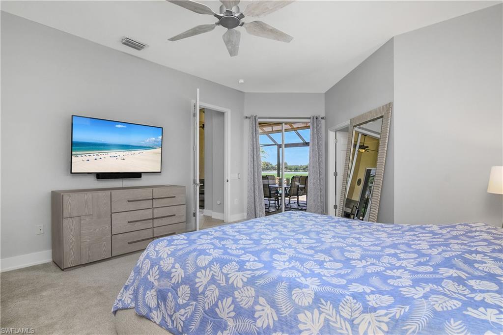 24361 Copperleaf Boulevard Estero, FL 34135 - Photo 17 of 49 a bedroom with a bed and a dresser