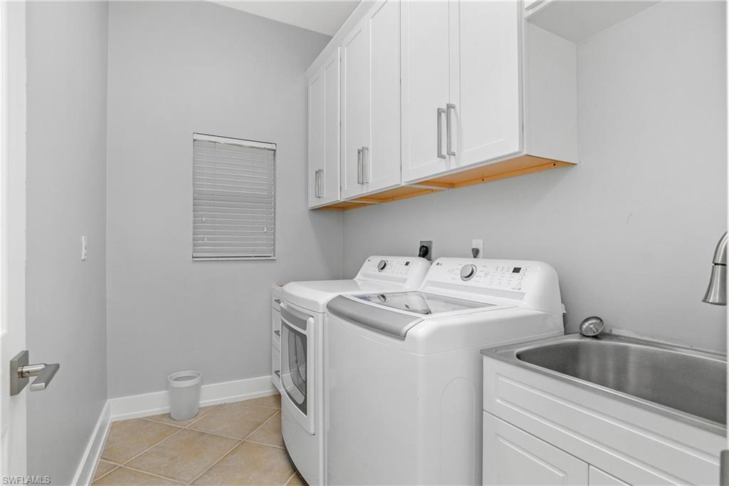 24361 Copperleaf Boulevard Estero, FL 34135 - Photo 23 of 49 a utility room with dryer and washer