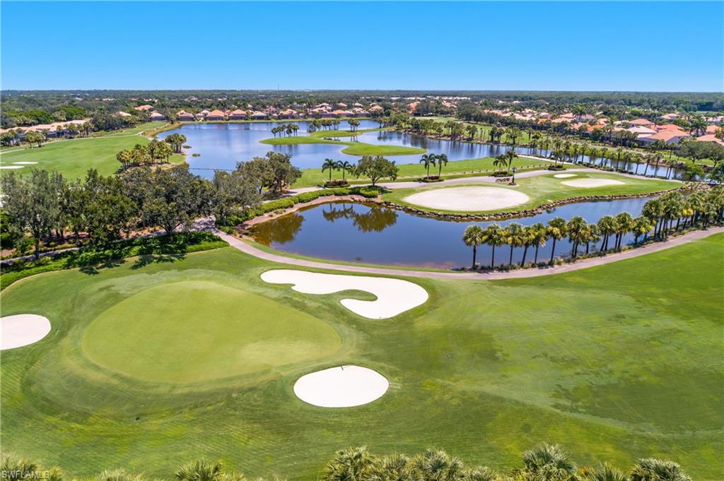 24361 Copperleaf Boulevard Estero, FL 34135 - Photo 29 of 49 a view of a swimming pool with lawn chairs and an ocean