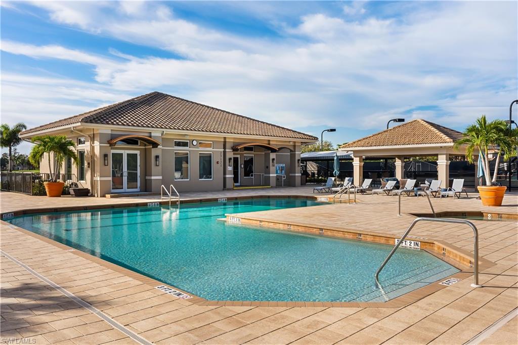 24361 Copperleaf Boulevard Estero, FL 34135 - Photo 41 of 49 a view of a house with swimming pool and sitting area