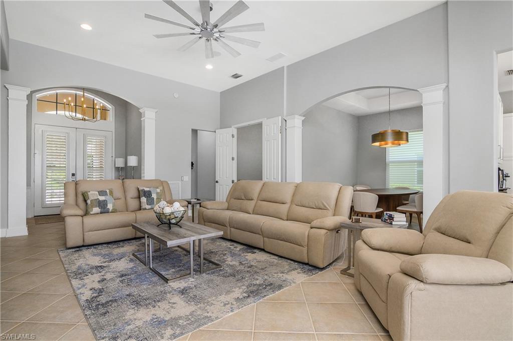 24361 Copperleaf Boulevard Estero, FL 34135 - Photo 5 of 49 a living room with furniture and a large window