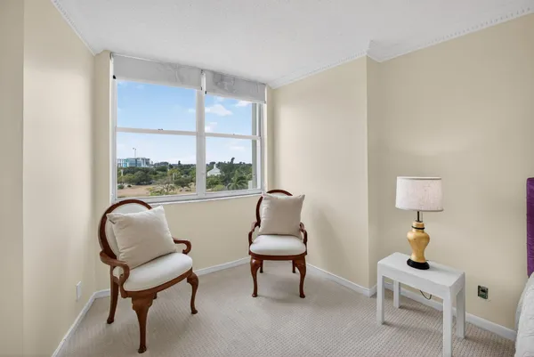 a room with a chair and a window