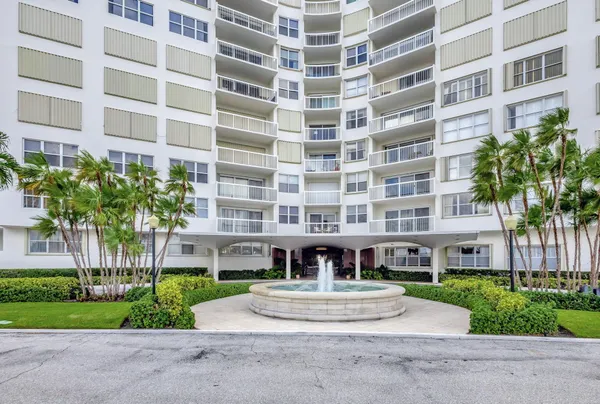 a view of a street with a building in the background