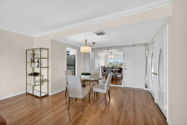 a view of a dining room with furniture and wooden floor
