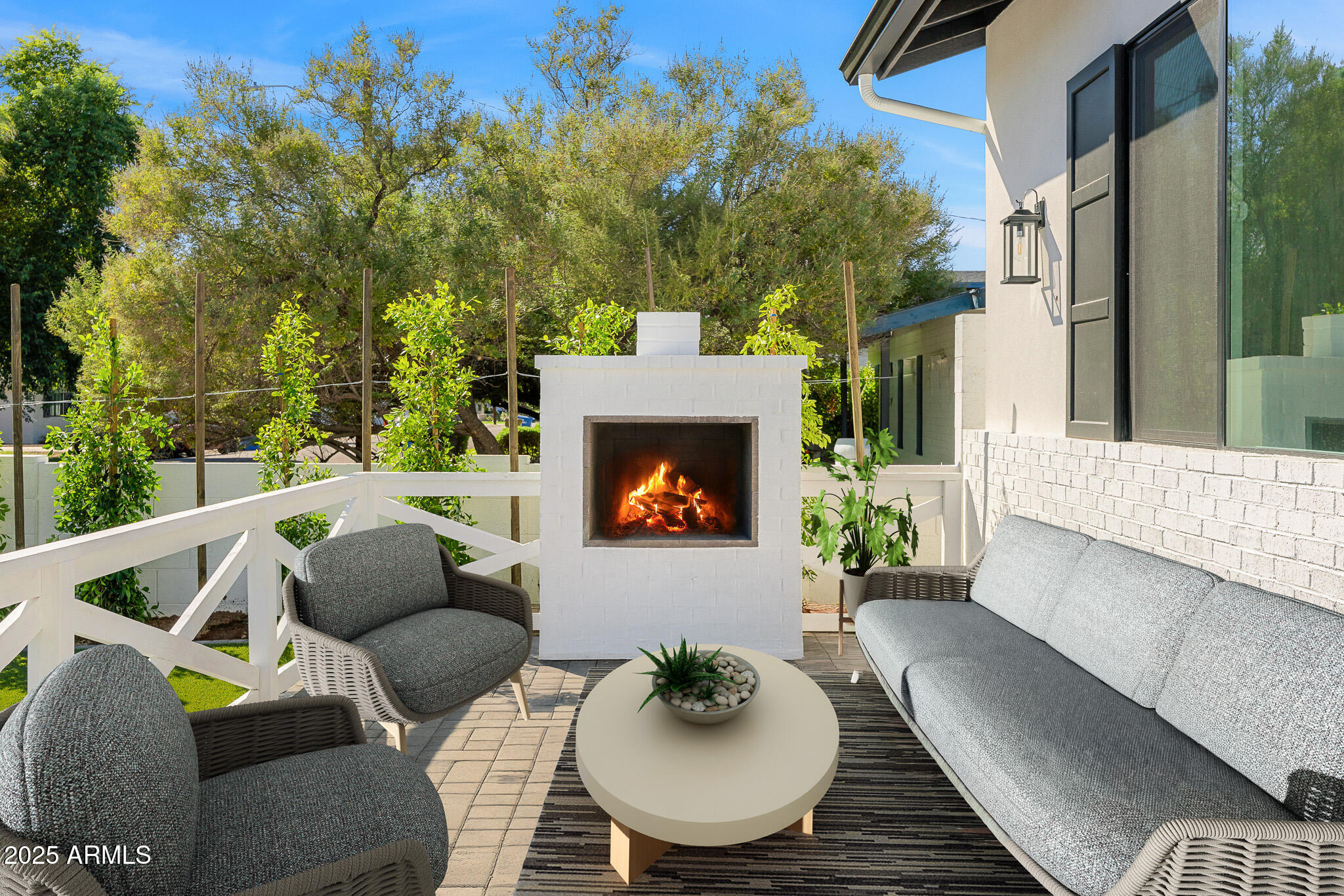 3002 North 53rd Place Phoenix, AZ 85018 - Photo 19 of 19 a outdoor living space with furniture and a fireplace