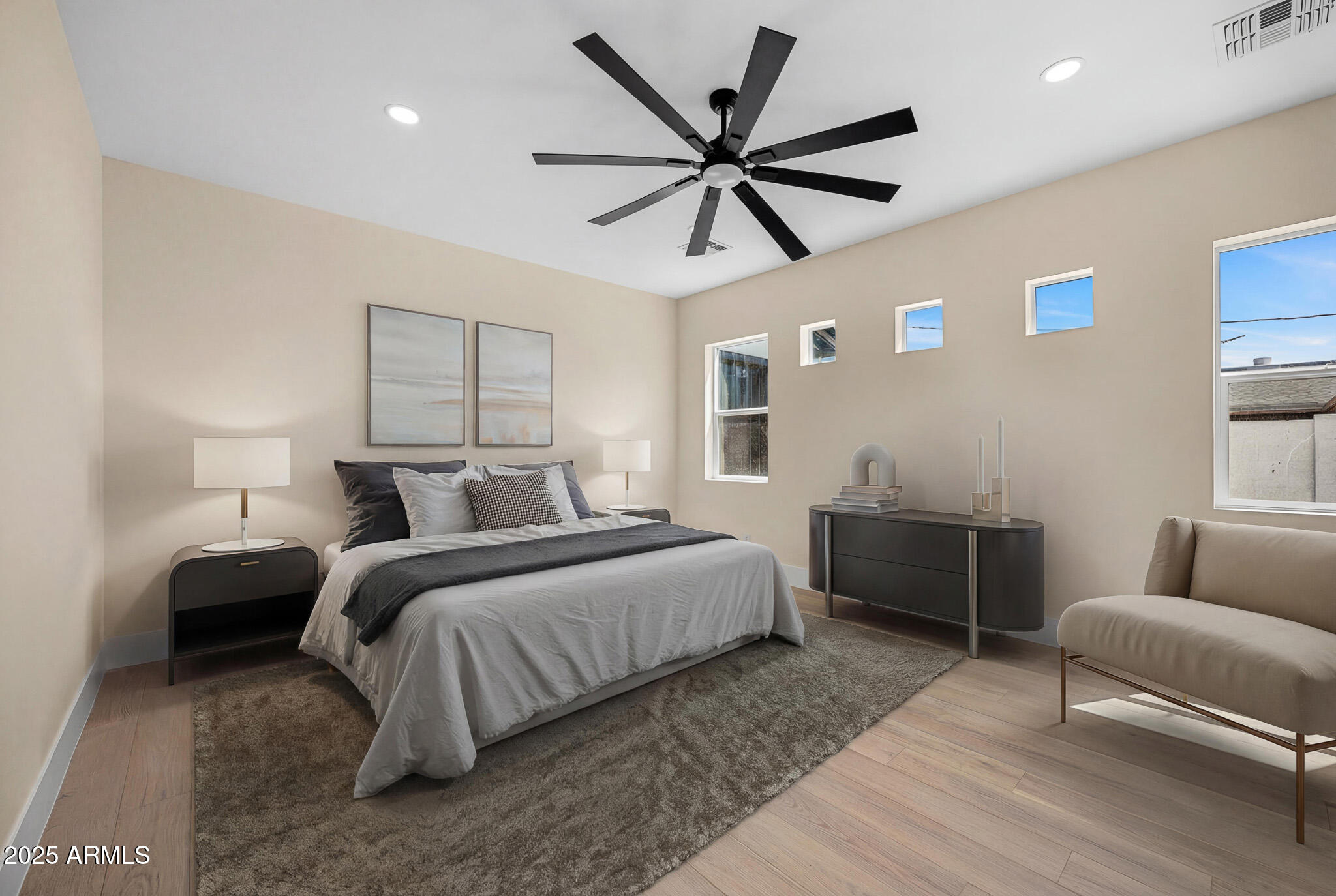 3002 North 53rd Place Phoenix, AZ 85018 - Photo 7 of 19 a bedroom with furniture and a large window